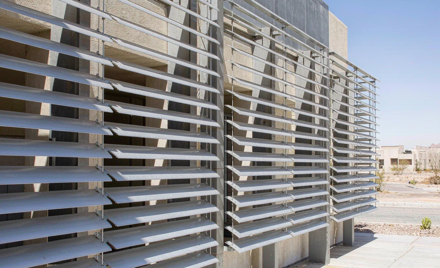 External aluminium shading louvers on an arid building facade