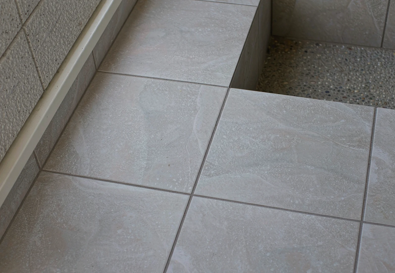 Close-up of matte glazed porcelain floor tiles in a hot-climate interior